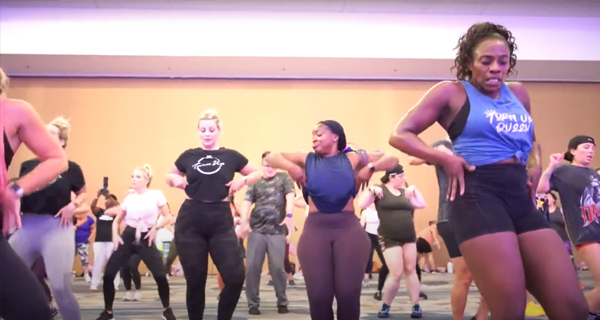 a group of ladies in a dance theatre partaking in a Turn Up Dance Fitness