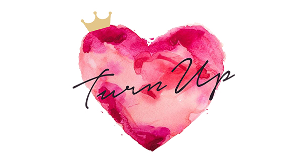 an heart icon with a crown with the Turn Up text through the centre